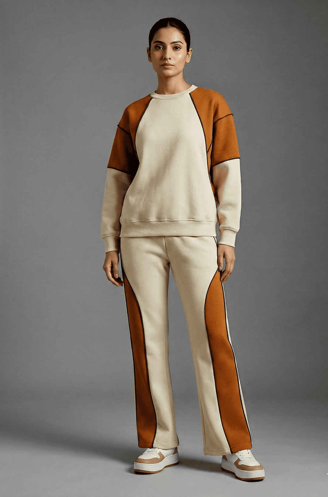 Risate women's colorblock co-ord set featuring a stylish sweatshirt and matching pants in neutral and orange tones
