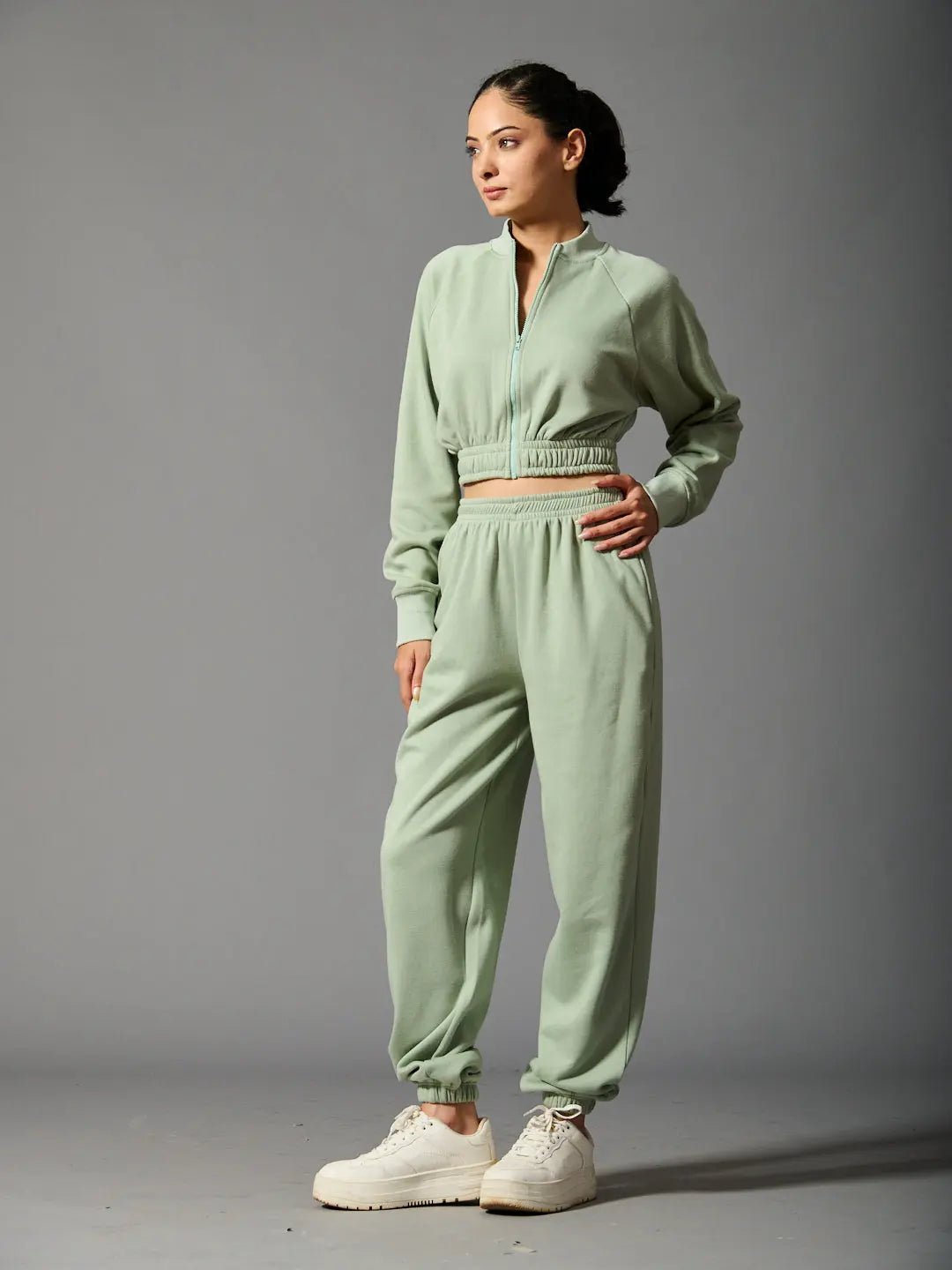 Women's cozy bomber set in soft green with zip-up jacket and matching joggers for a comfortable look