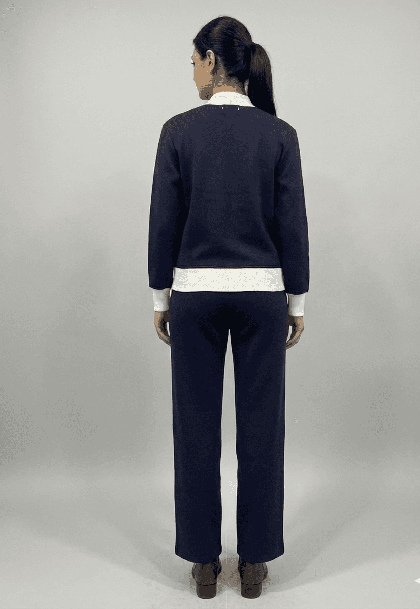 Back view of women's fleece co-ord set in navy blue with a stylish white collar