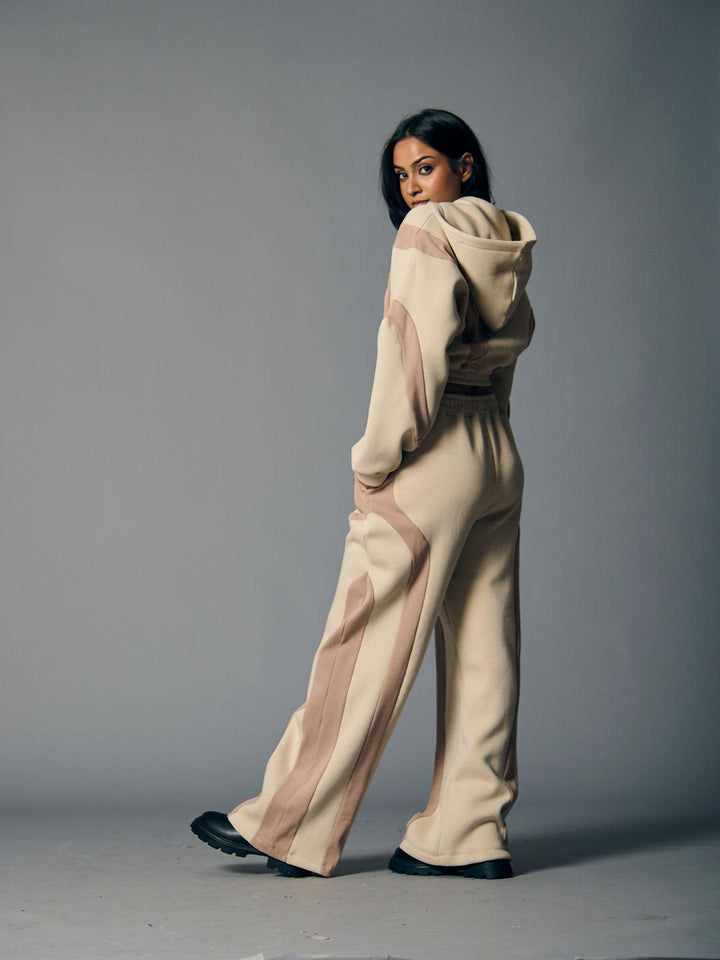 Stylish women's fleece coord set with a hood and relaxed fit in neutral tones