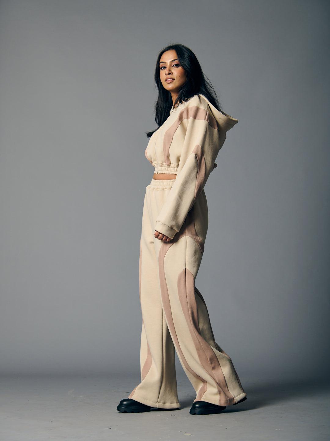 Trendy women's fleece coord set by Risate featuring a hooded top and matching pants in a stylish design