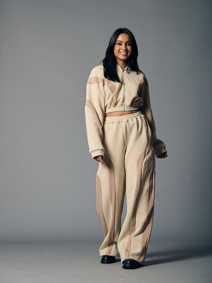 Stylish women's fleece coord set in beige with pink stripes, perfect for casual wear or lounging