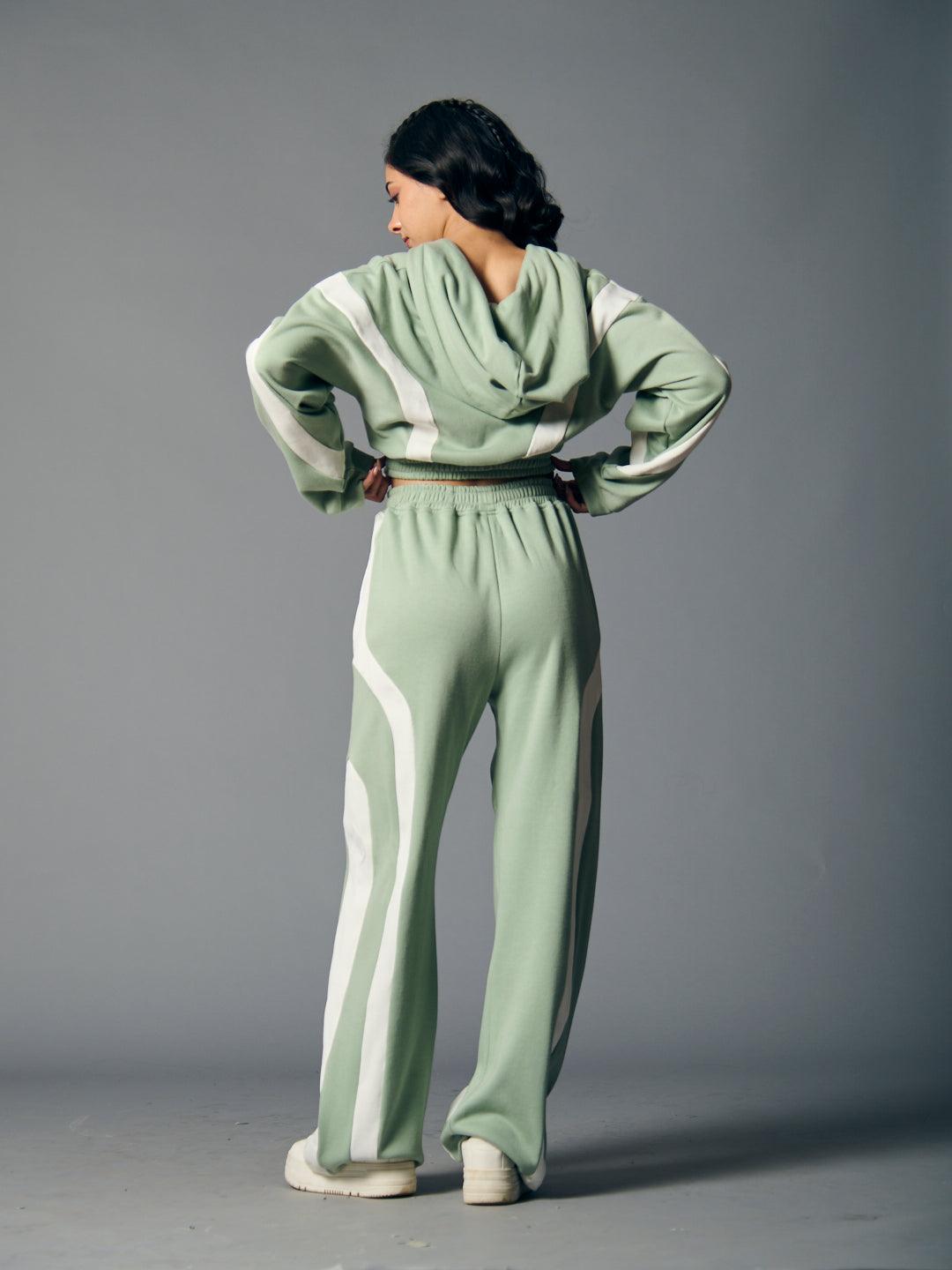Stylish women's fleece coord set in green featuring a hooded top and matching pants