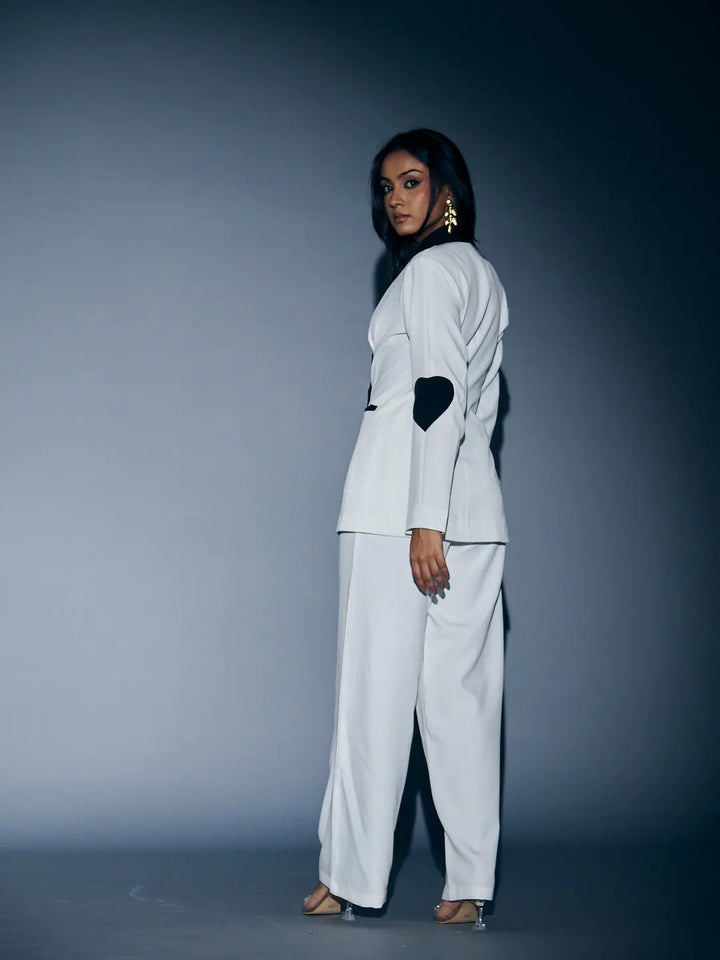 Risate women's heart patch pant suit in white featuring stylish design and modern silhouette