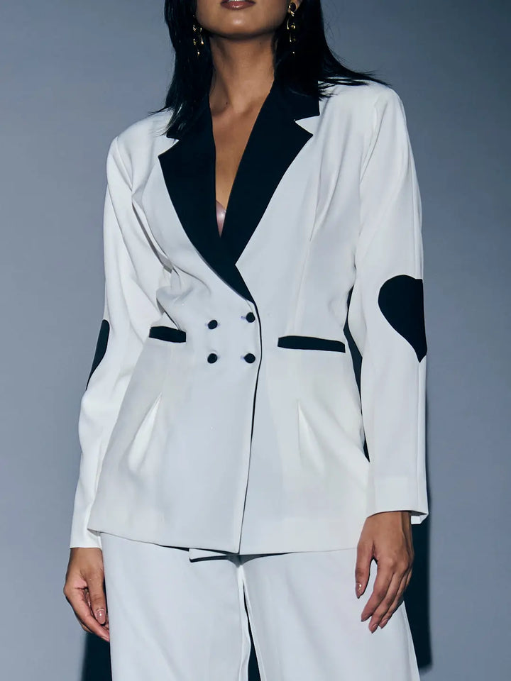 Risate women's heart patch pant suit in white featuring stylish heart accents and a tailored fit