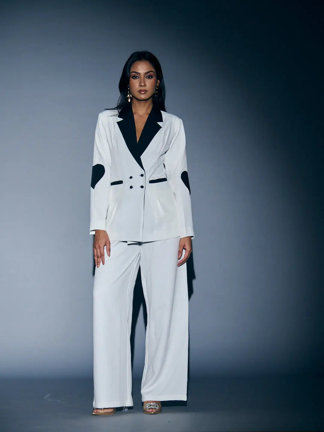 Stylish women's heart patch pant suit in white and black by Risate, perfect for chic occasions