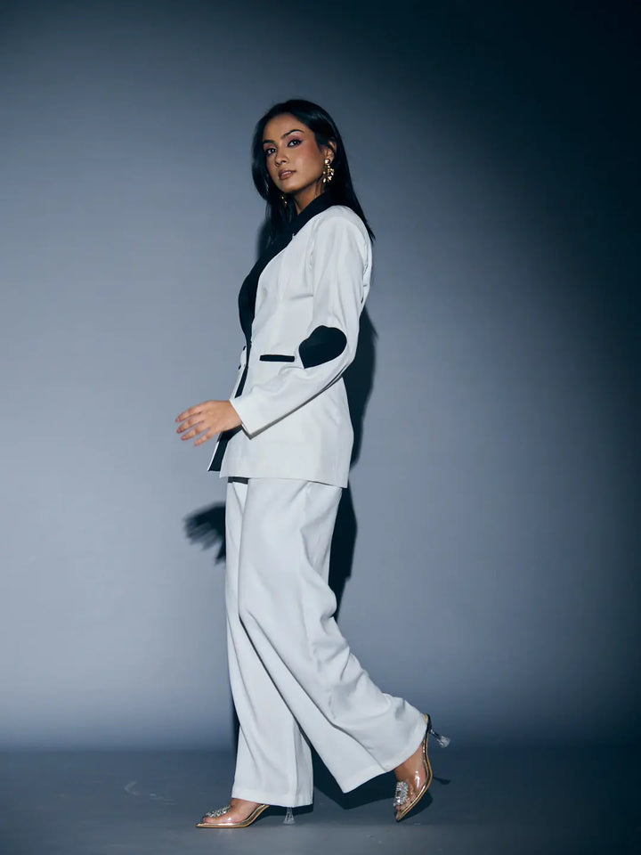 Risate women's heart patch pant suit in white, featuring stylish black accents and tailored fit