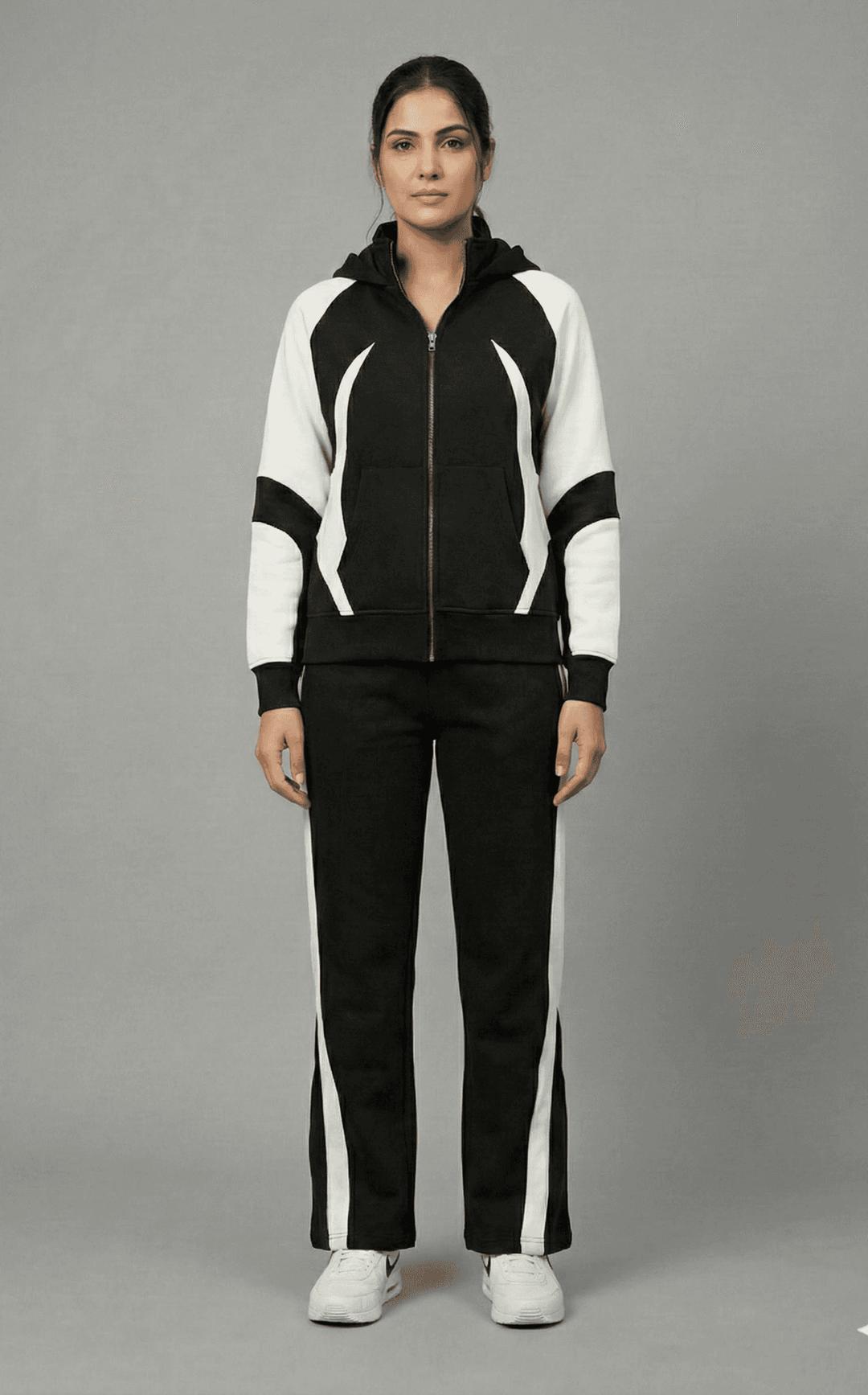 Risate women's monochrome tracksuit set featuring a zip-up jacket and matching pants for a stylish look