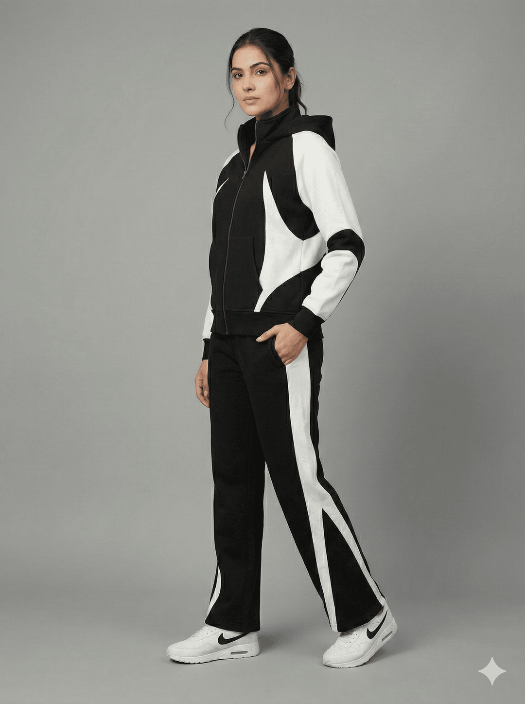 Risate women's monochrome tracksuit set featuring a stylish zip-up jacket and matching pants