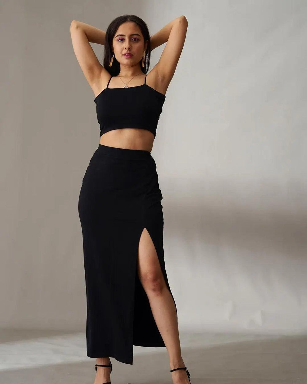 Risate women's summer co ord sets featuring a black crop top and high-slit maxi skirt for a stylish look