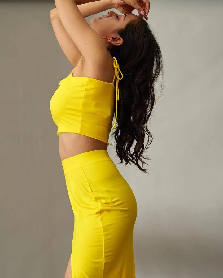Risate women's summer co ord sets in vibrant yellow featuring a crop top and matching skirt