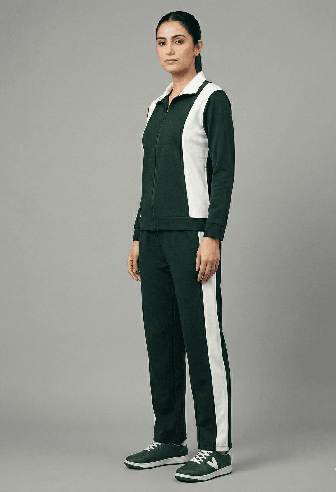 Risate women's tracksuit set featuring a zip-up jacket and matching pants in dark green and white