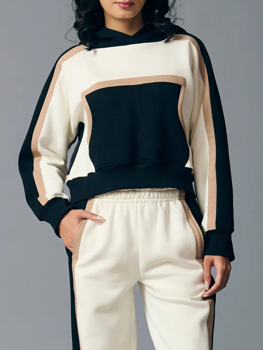 Risate women's two piece western set featuring a stylish hooded crop top and matching pants in black and beige