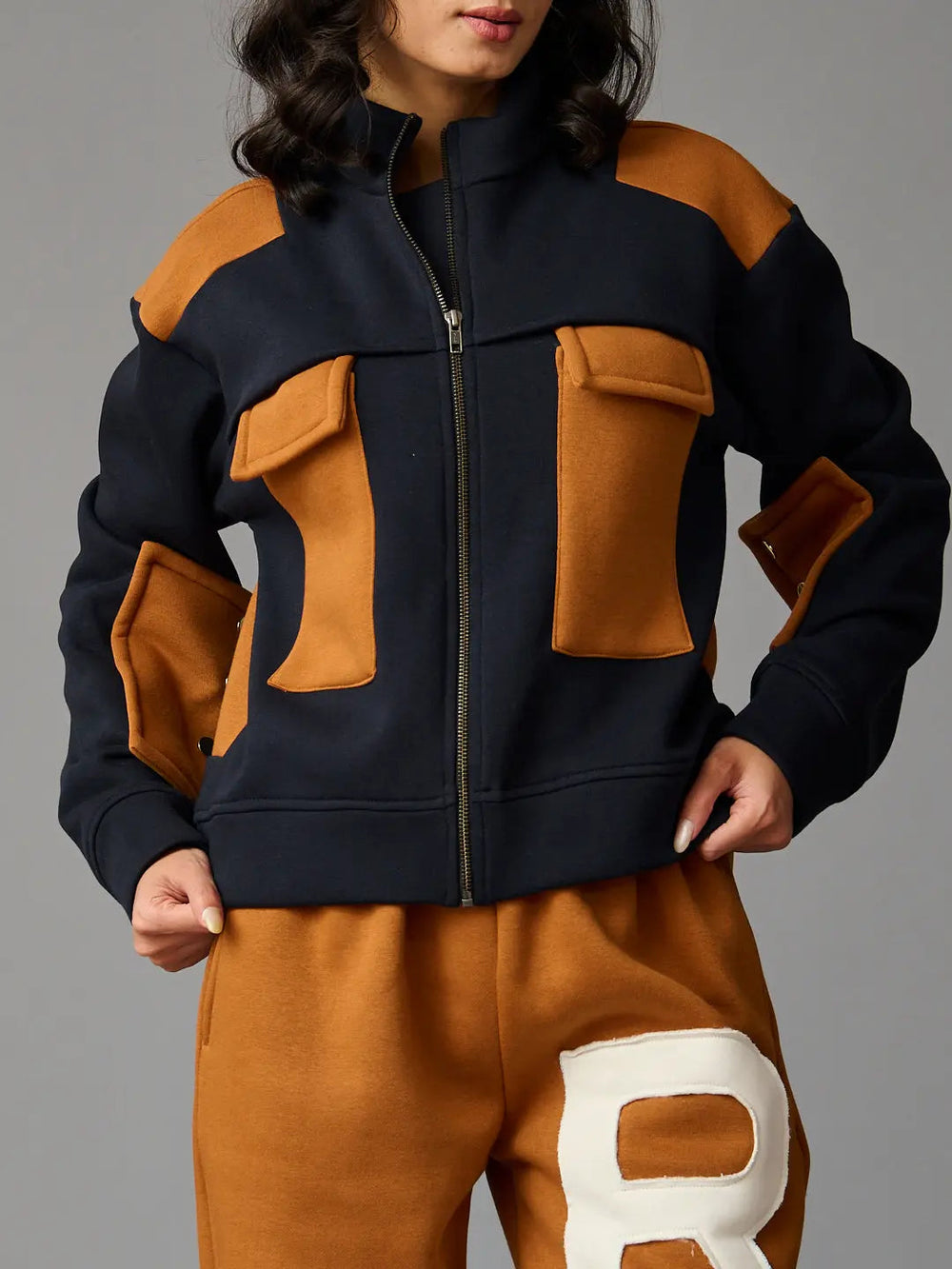 Risate women's western luxe jacket in navy and brown with multiple front pockets for stylish layering