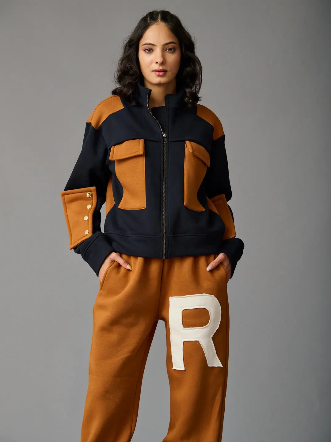 Risate women's western luxe jacket in navy and tan with zip closure and pocket details