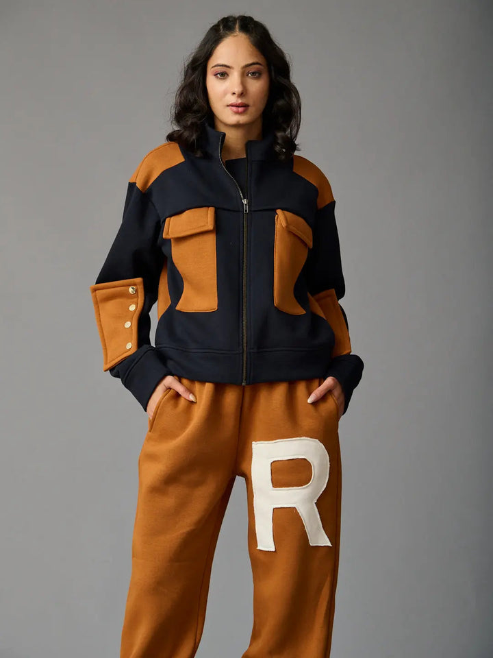 Risate women's western luxe jacket in navy and tan with zip closure and pocket details
