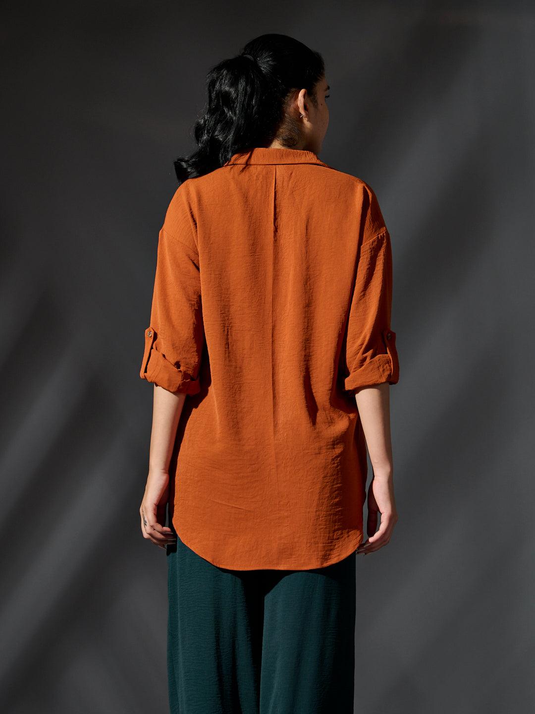 Risate women's western shirts in rust color with roll-up sleeves and a relaxed fit
