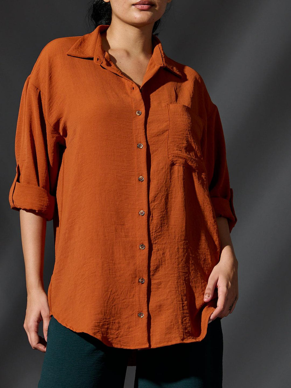 Risate women's western shirts in rust color with a relaxed fit and button-down design