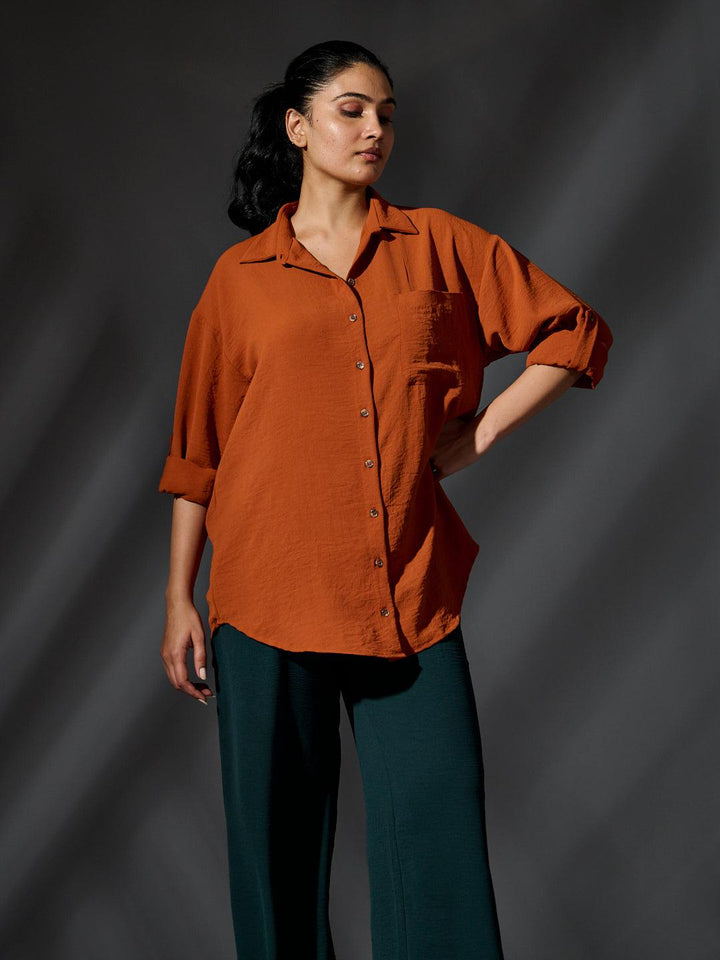 Risate women's western shirts in rust color, featuring a relaxed fit and button-down design for casual style