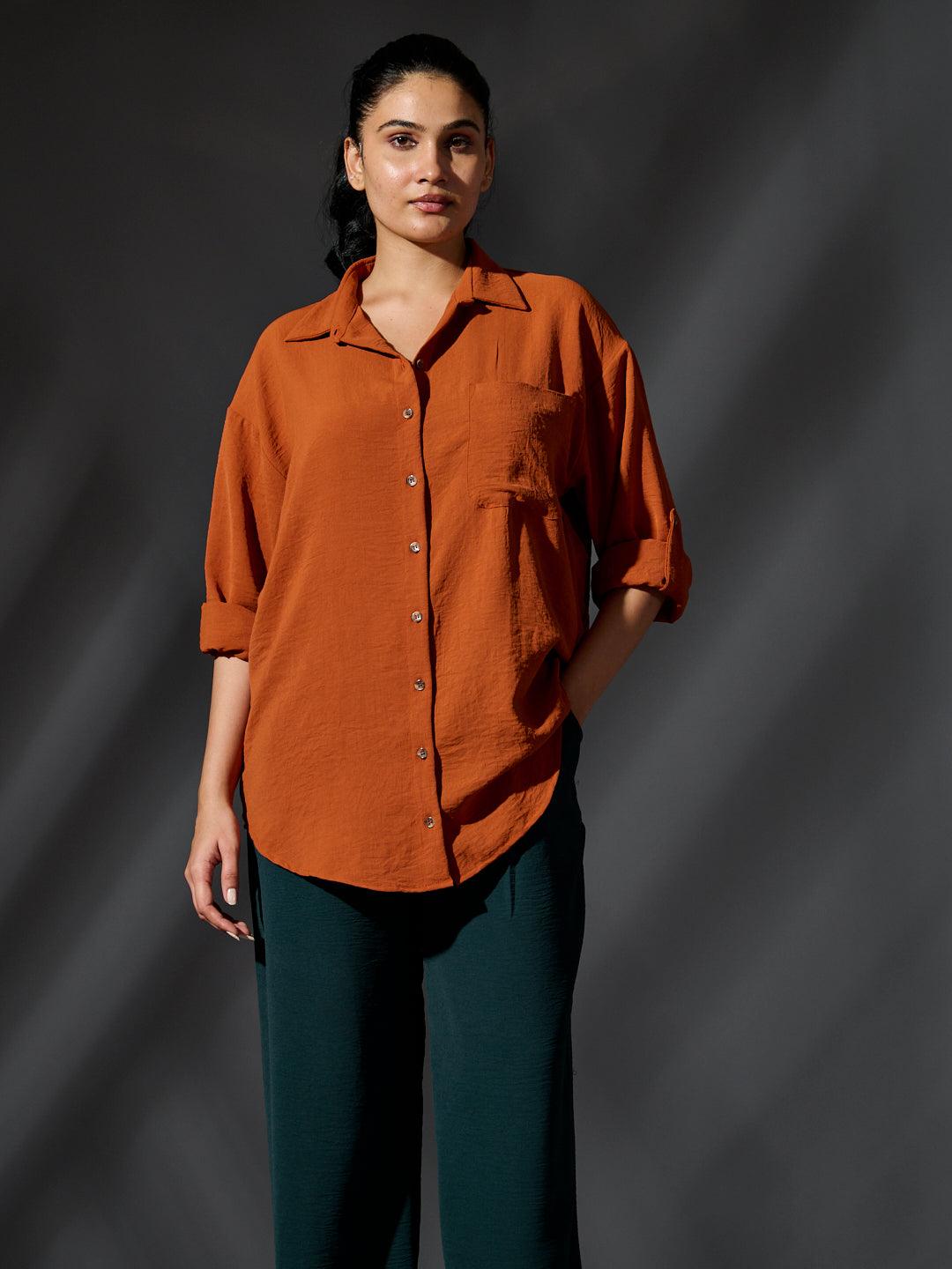 Risate women's western shirts in orange with a relaxed fit and rolled sleeves for casual style