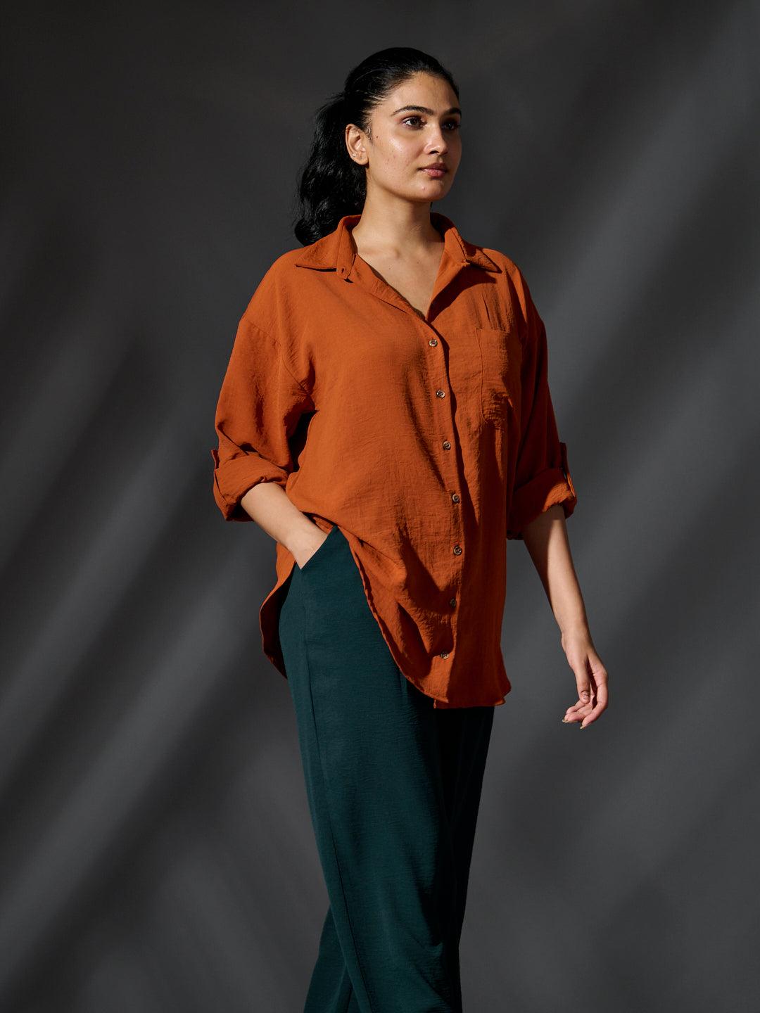 Risate women's western shirts in rust color with a relaxed fit and rolled sleeves