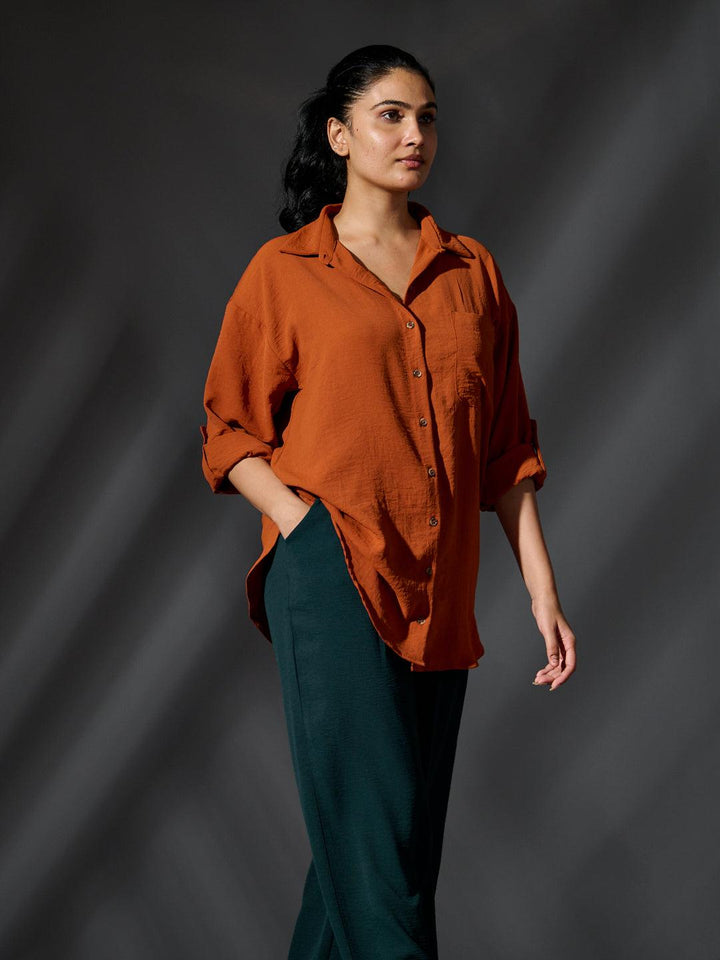 Risate women's western shirts in rust color with a relaxed fit and rolled sleeves