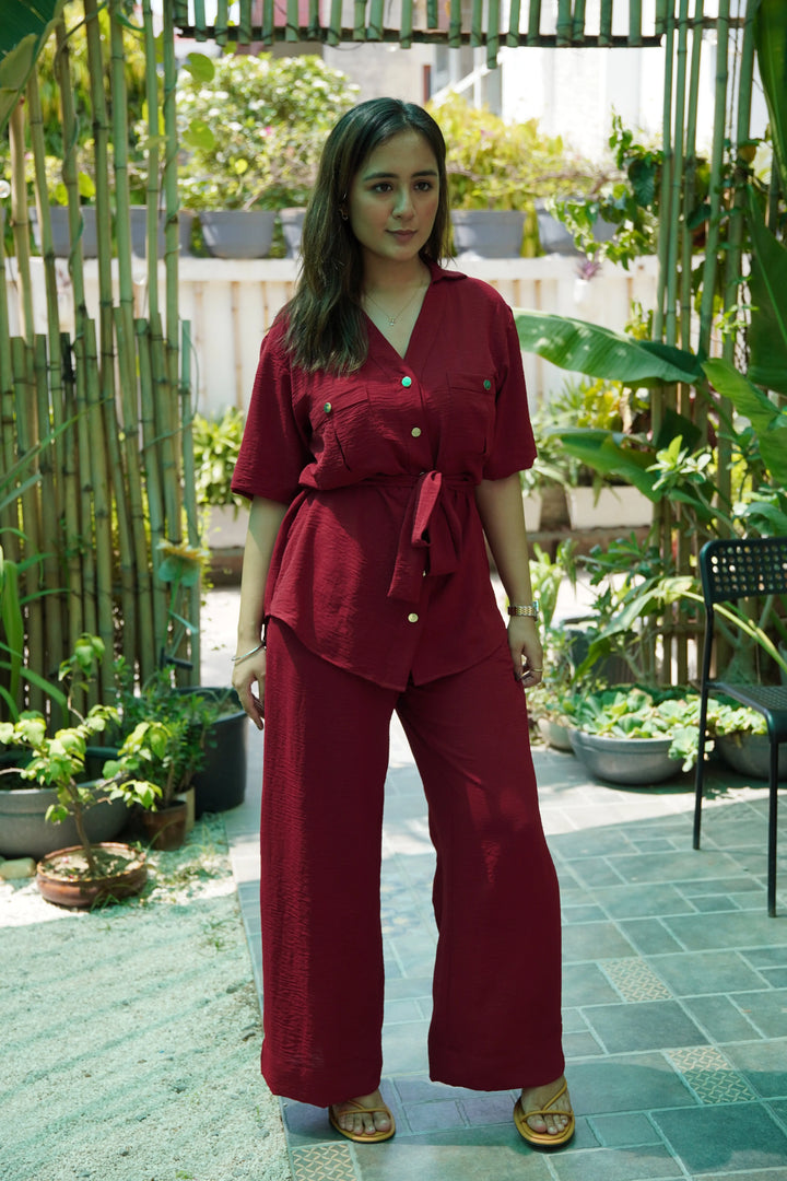 Risate women's western wear set in burgundy, featuring a button-up shirt and wide-leg pants, styled outdoors