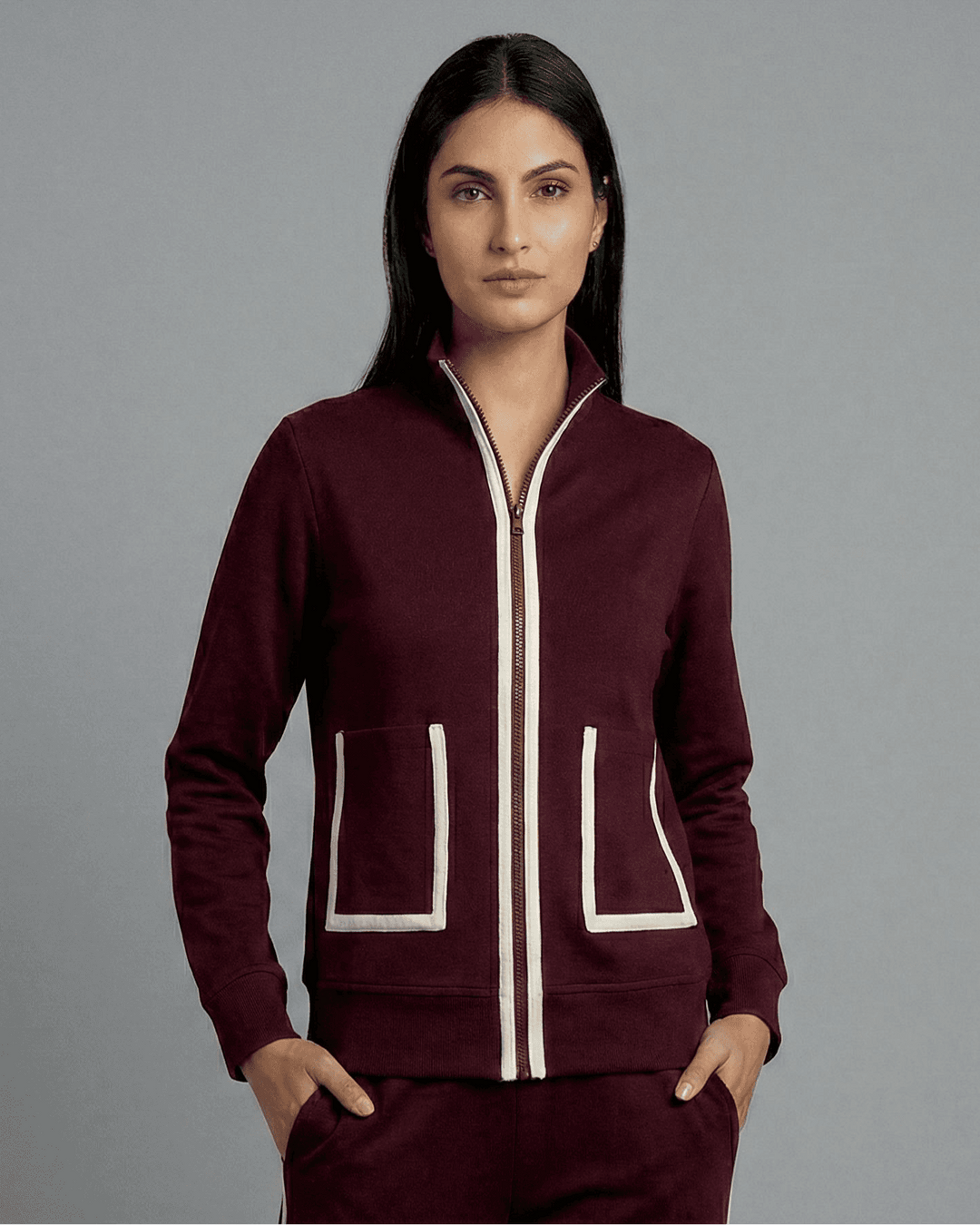 Risate women's wine track set in burgundy featuring a zip-up jacket with contrasting pockets