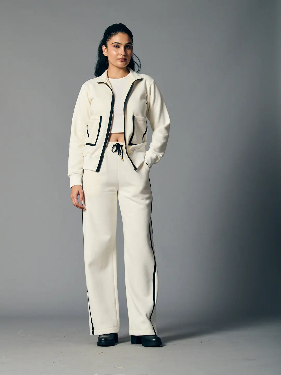 Risate women's zipper coord set in cream with contrasting black trim and relaxed fit pants