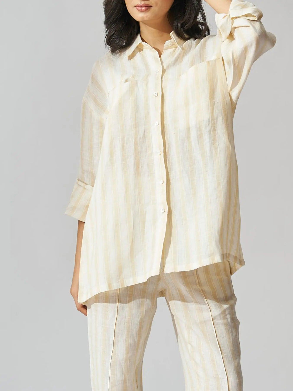 Yellow stripes linen coord set for women featuring a button-up shirt and matching pants